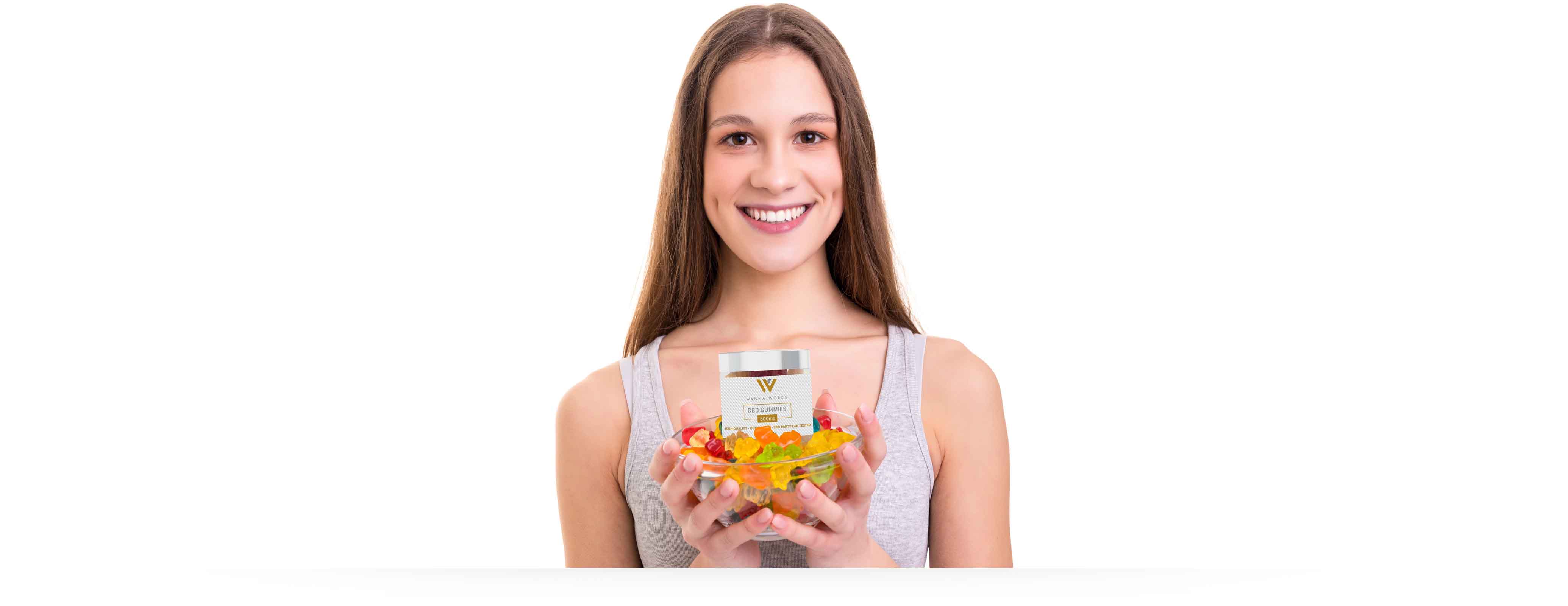 image of woman using holding bowl of gummies